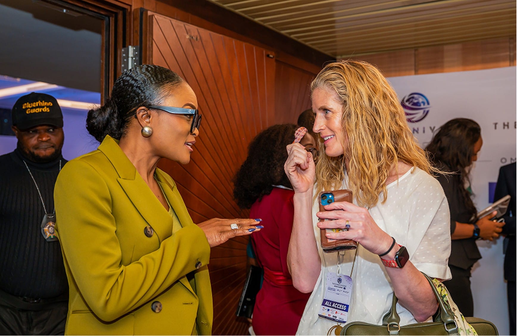 Oiza Nicholson in conversation with a delegate