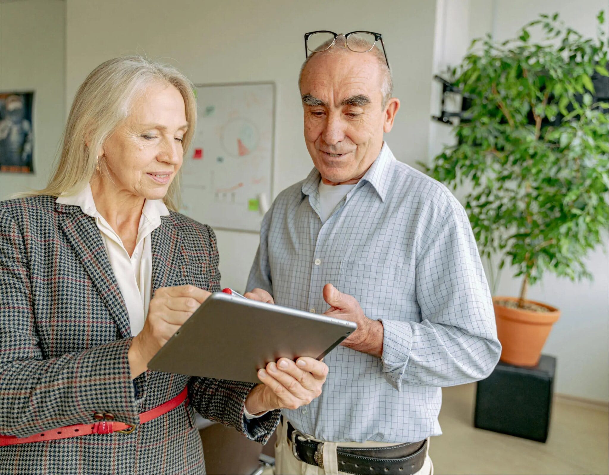 Colleagues reviewing data on a tablet