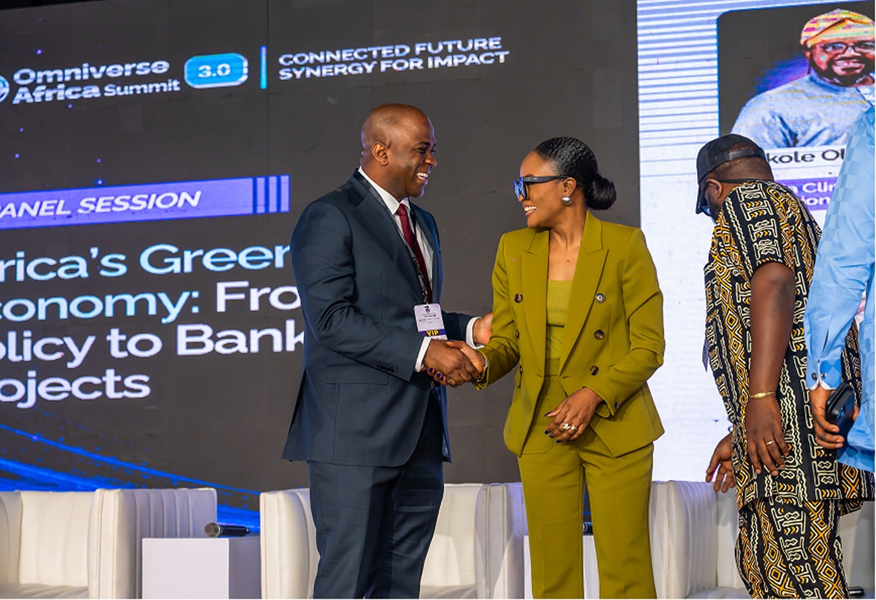 Panellists greeting on stage
